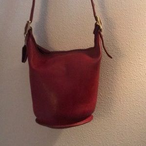 Coach in Helens legacy duffle bucket bag style.